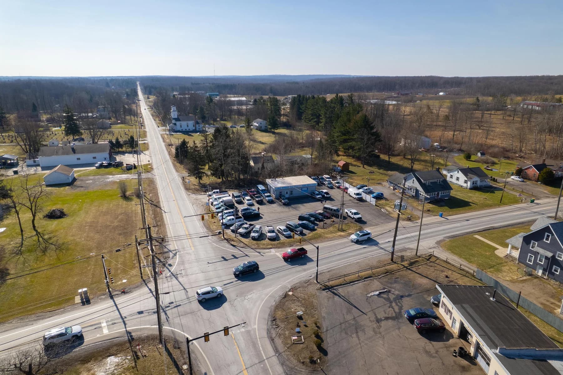 Drone photograph showing Lake Effect’s building, roadside sign, and rows of vehicles