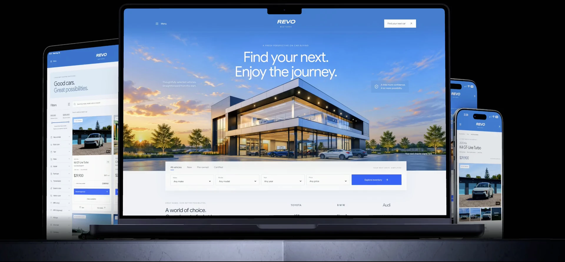 Open MacBook and iPad displaying the Revo Motors dealership website
